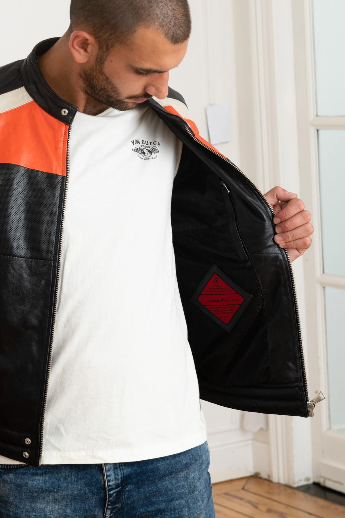 Redskins' black sheepskin jacket with bold orange and white stripes. - Image n°4