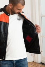 Redskins' black sheepskin jacket with bold orange and white stripes. - Image n°4