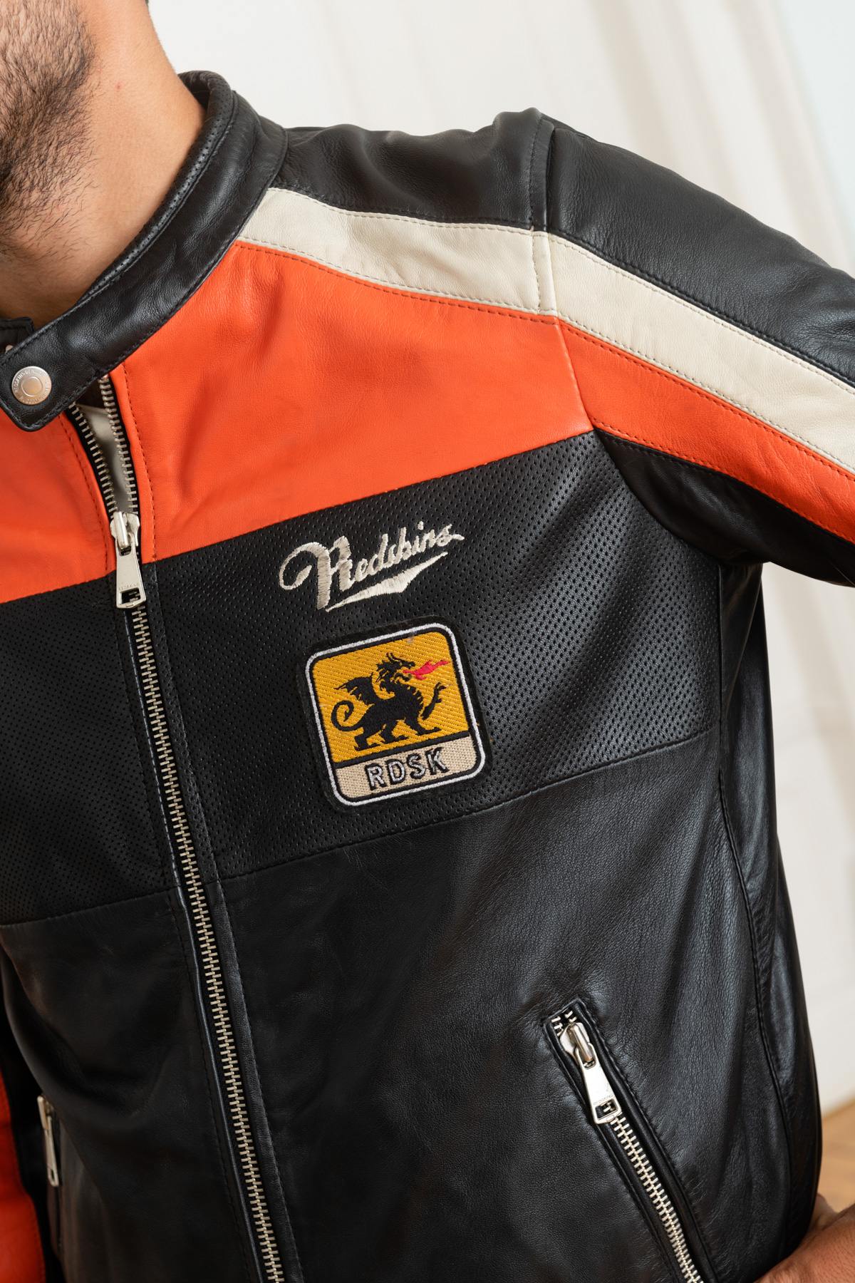 Redskins' black sheepskin jacket with bold orange and white stripes. - Image n°8