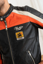 Redskins' black sheepskin jacket with bold orange and white stripes. - Image n°8