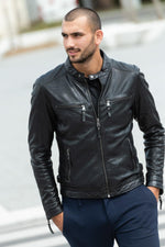 A black sheepskin jacket with a slim, modern cut for effortless style. - Image n°1