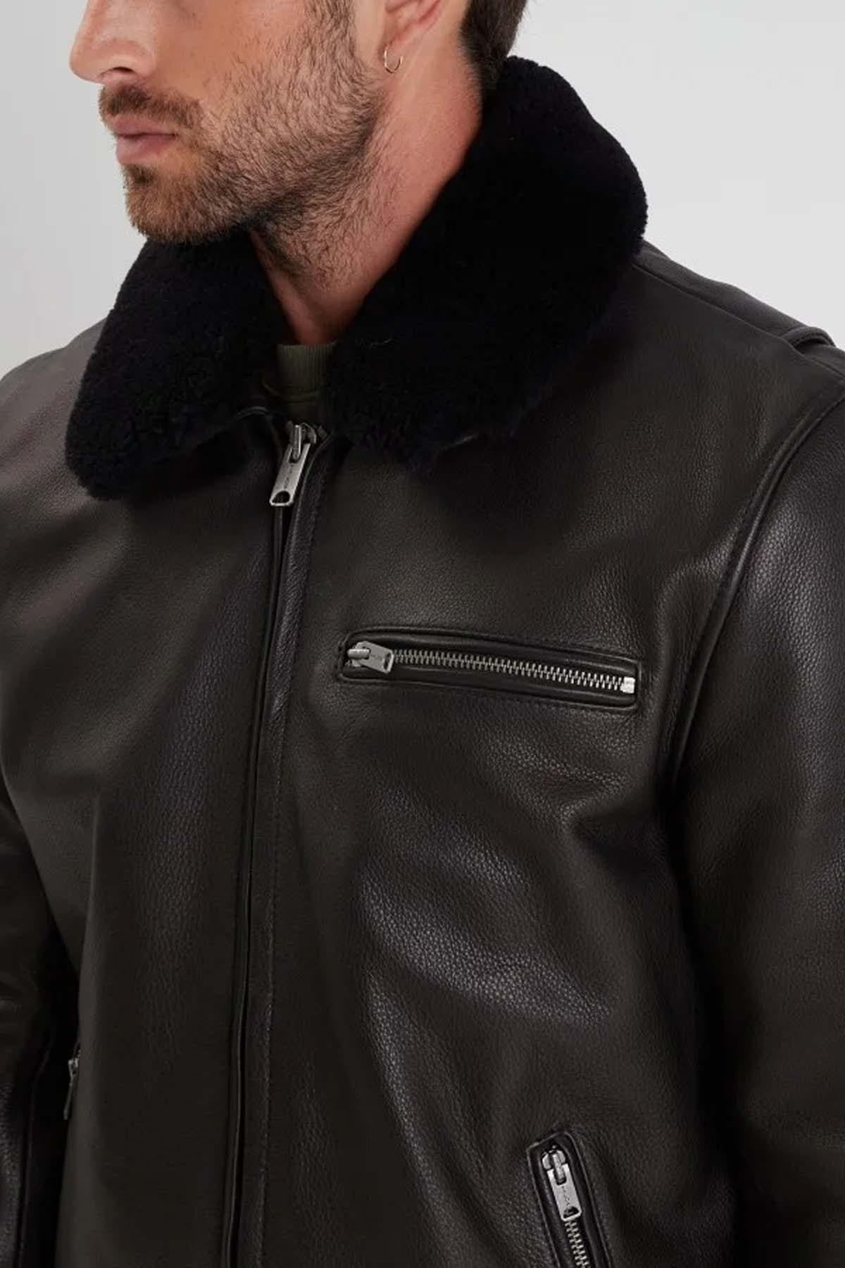 Black grain-textured cowhide jacket with detachable fur collar. - Image n°3