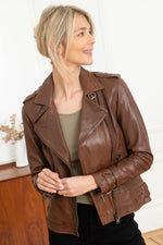 Mid-brown sheepskin biker jacket with vintage patina and adjustable straps. - Image n°1