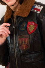 Slim maroon goatskin bomber with 17 patches and a detachable collar. - Image n°9