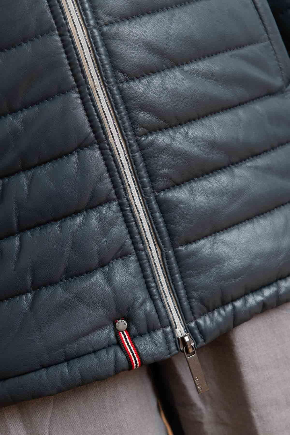 A tailored lambskin coat in petrol blue, quilted for warmth and style. - Image n°3