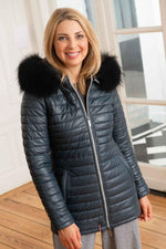 A tailored lambskin coat in petrol blue, quilted for warmth and style. - Image n°1