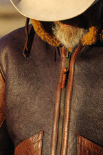 Tobacco-cognac lambskin bomber with warm shearling lining. - Image n°5