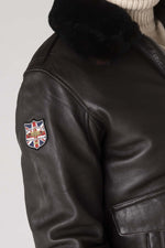 Dark brown sheepskin aviator jacket with RAF insignias and fur collar. - Image n°4
