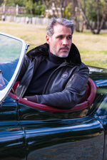 Black leather bomber jacket with fur collar - Image n°1