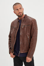 Dark cognac lambskin biker jacket with quilted shoulders and straps. - Image n°1