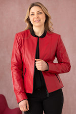 Glossy red and black lambskin jacket, slim-fit for chic evening wear. - Image n°1