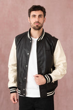 Schott's varsity-style lambskin jacket in black and off-white. - Image n°1