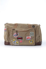 Textile travel bag with taupe and brown patches - Image n°1