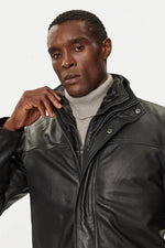 Black lambskin parka with detachable vegan-fur hood for urban warmth. - Image n°4