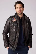 Dark brown lambskin jacket with military roots and French elegance. - Image n°1