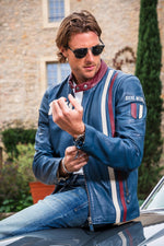 Steve McQueen's 1970s racing legacy in a royal blue sheepskin jacket. - Image n°1