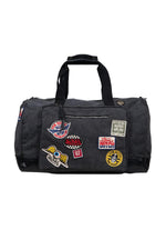 Grey travel bag with patches - Image n°1