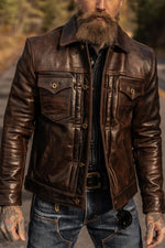 Rustic mahogany buffalo leather trucker jacket with western stitching. - Image n°2