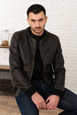 Bonbon: aged black and beige sheepskin teddy. Ribbed cuffs, zip front. - Image n°1