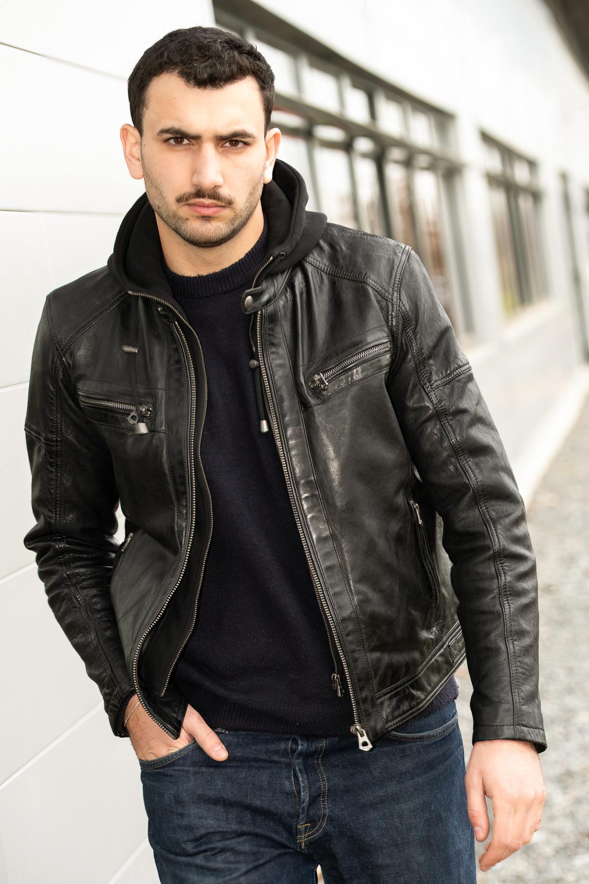 Slimfit lambskin jacket in glossy black. Moto collar, detachable hood. - Image n°1