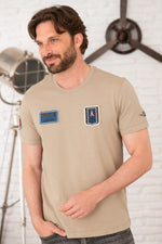 Sand-colored cotton T-shirt with distressed patches - Image n°1