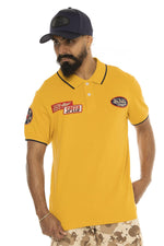 Yellow cotton twill polo shirt with badges - Image n°1