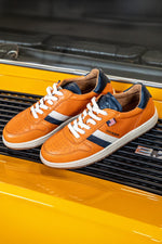 Steve McQueen orange leather sneakers - Image n°1