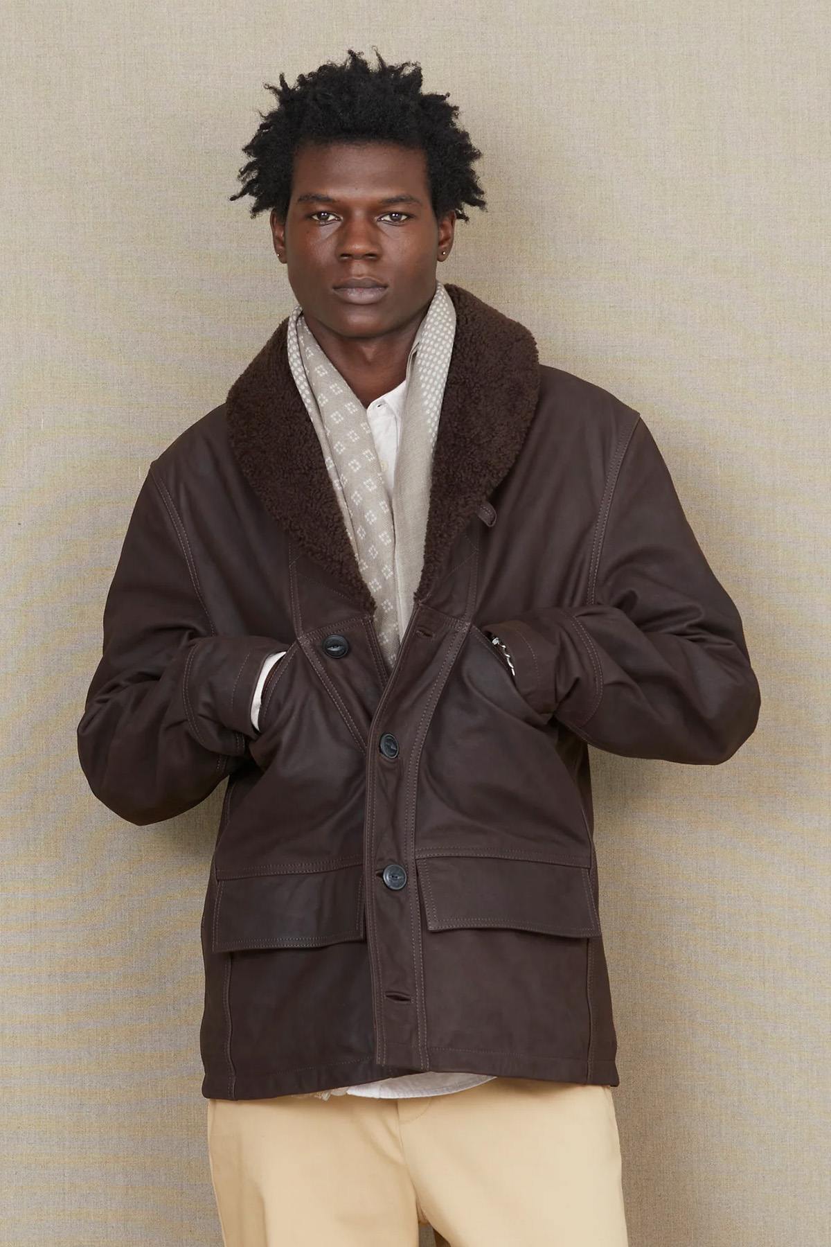 Chevignon's cacao cowhide coat with fur-trimmed shawl collar. - Image n°1