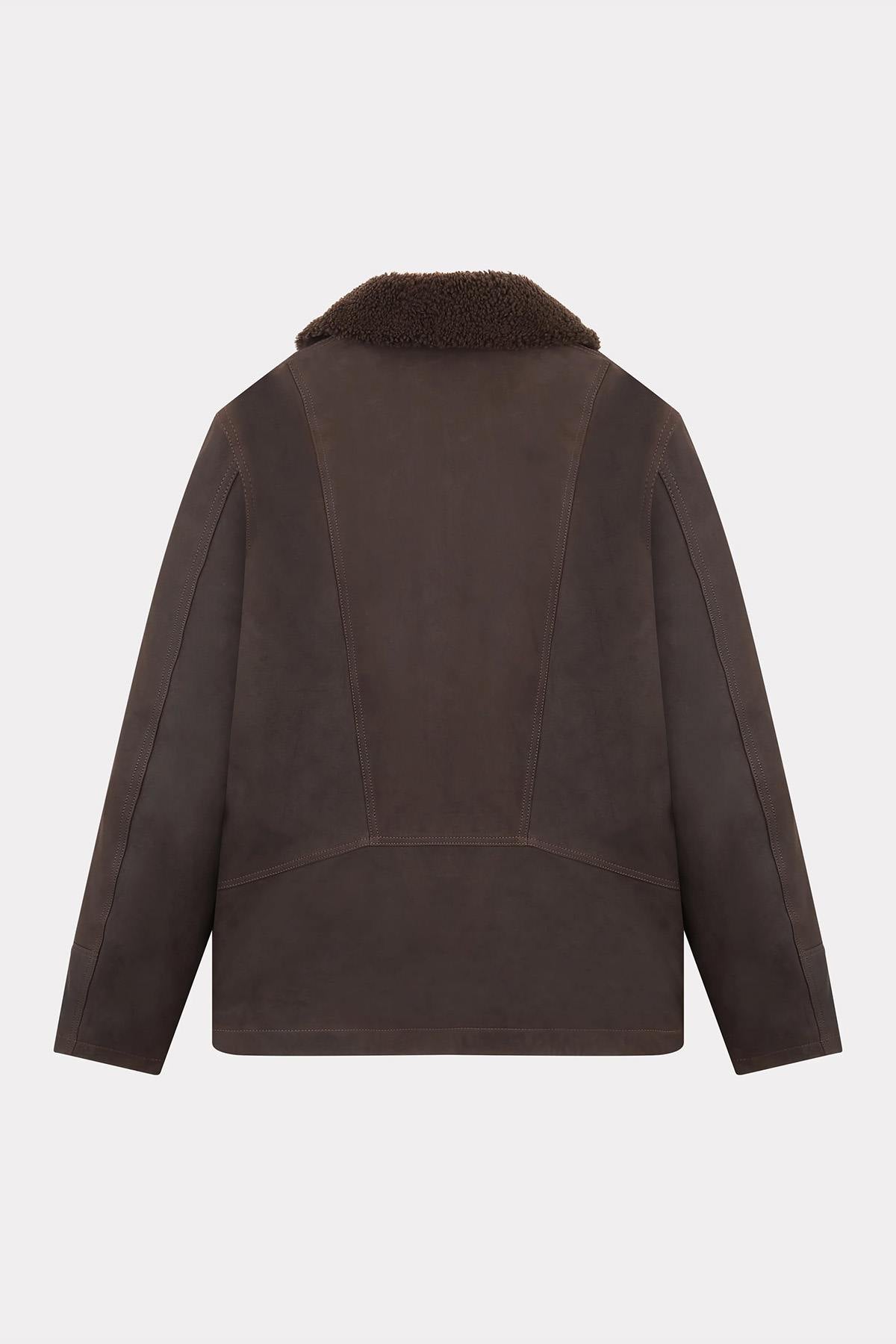Chevignon's cacao cowhide coat with fur-trimmed shawl collar. - Image n°8