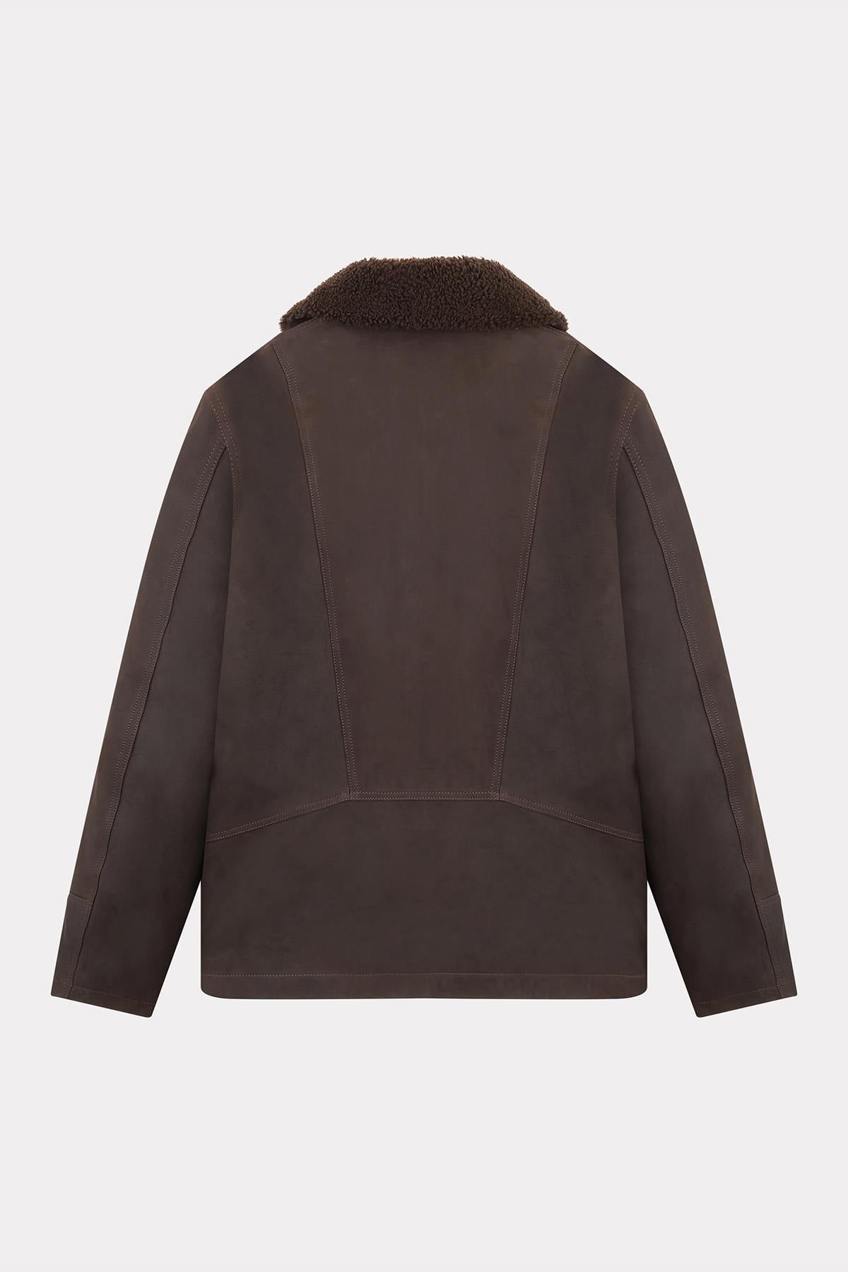 Chevignon's cacao cowhide coat with fur-trimmed shawl collar. - Image n°8