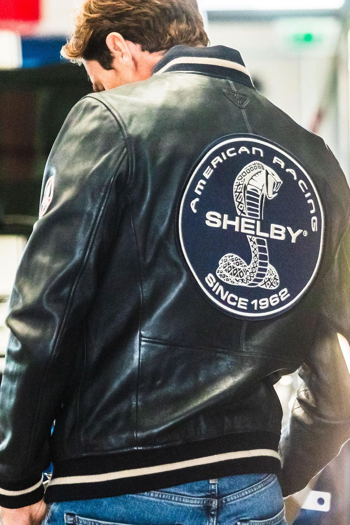 Navy blue leather jacket with Shelby logo on the back - Image n°1