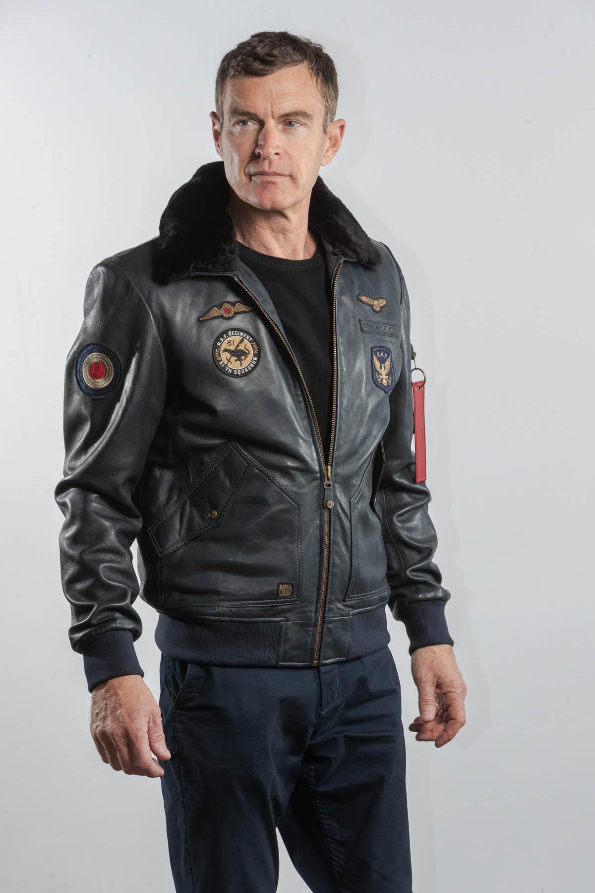 Navy blue leather bomber jacket with Royal Air Force patches - Image n°1