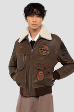 Brown leather bomber jacket with vintage badges - Image n°1