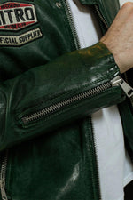 Green leather jacket with textured shoulders and racing badges - Image n°3