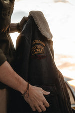 Distressed black leather aviator jacket with patches - Image n°15