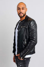 Black leather biker jacket with tone-on-tone patches and embroidery - Image n°1