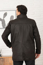 Dark brown buffalo leather parka with faux-fur hood and wool warmth. - Image n°2