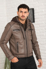 Serge Pariente's taupe lambskin jacket with a removable jersey hood. - Image n°4