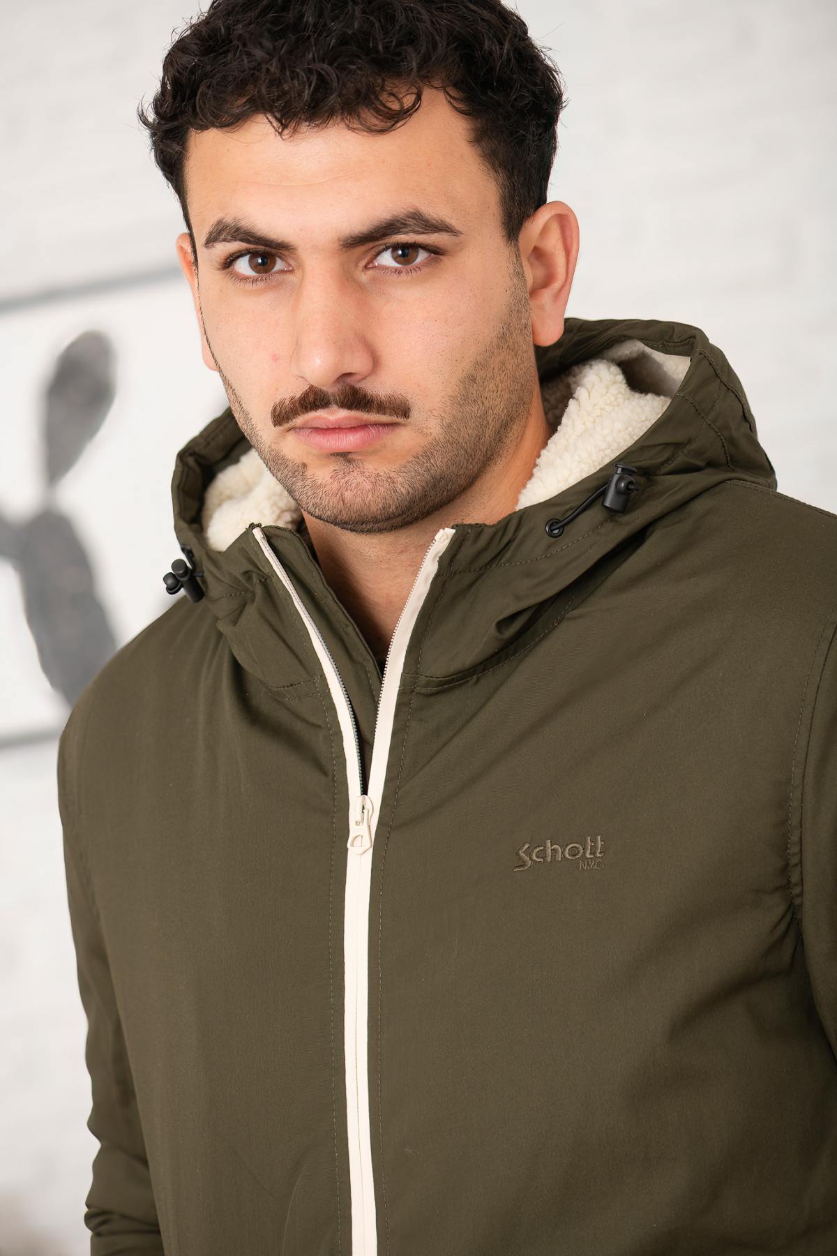 Schott's dark khaki hooded jacket: rugged, urban, and built to last. - Image n°2