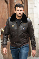 Dark brown leather bomber jacket with Royal Air Force patches - Image n°1