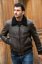 Vintage dark brown leather bomber jacket with back print - Image n°1