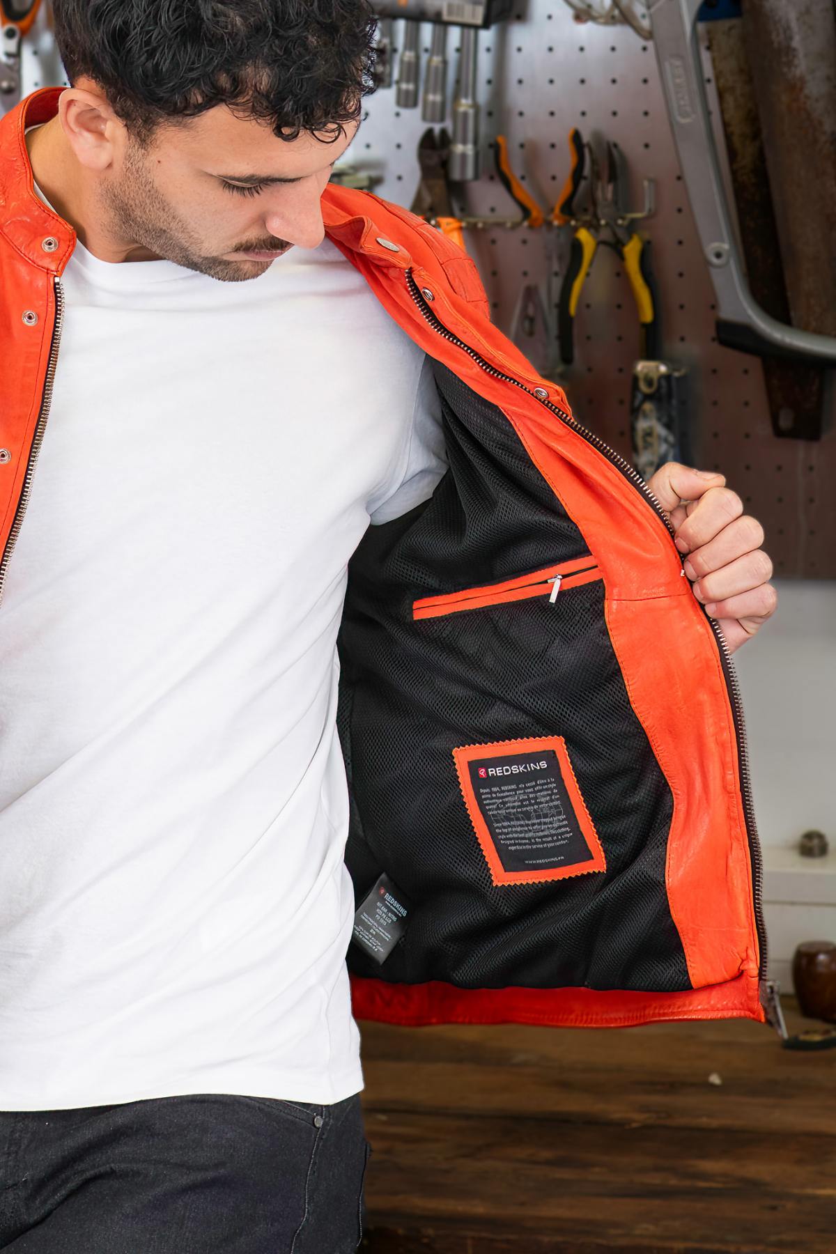 Bold orange lambskin moto jacket with quilted shoulders and patches. - Image n°5