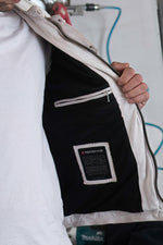 Off-white lambskin biker jacket with quilted detailing and patches. - Image n°9