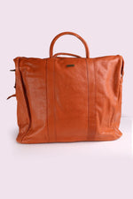 High-end leather travel bag in cognac color. - Image n°4