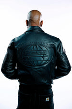 Black cowhide jacket with 3D embroidery and a structured teddy cut. - Image n°7