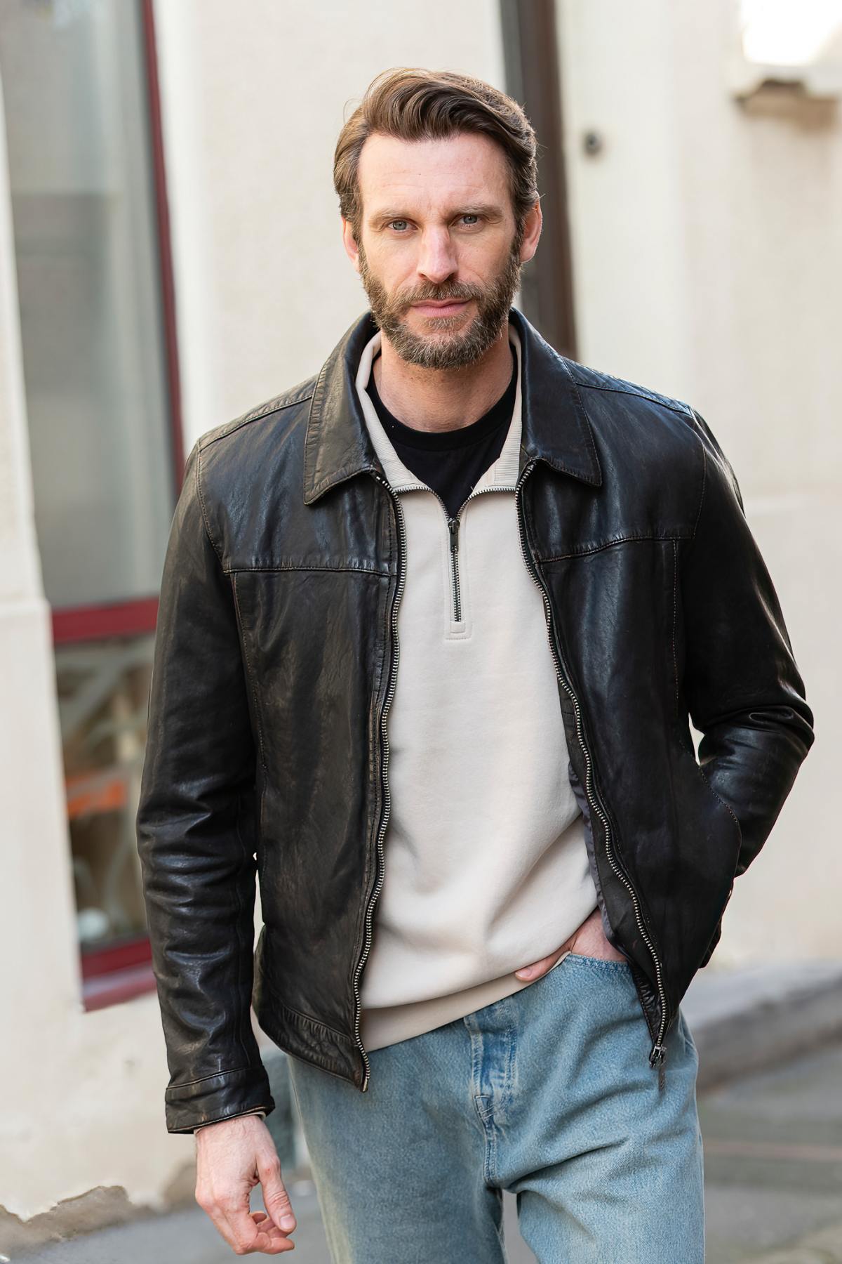 Black lambskin jacket with an aged finish, soft and lightweight. - Image n°1
