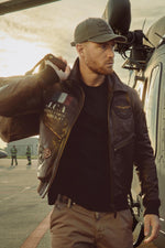 Patched and printed brown leather pilot jacket - Image n°1