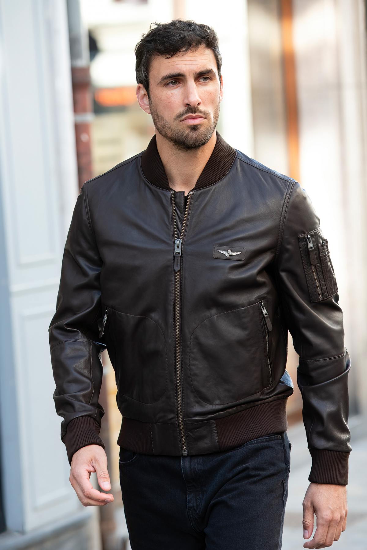Brown leather bomber jacket with metal eagle on the chest - Image n°1