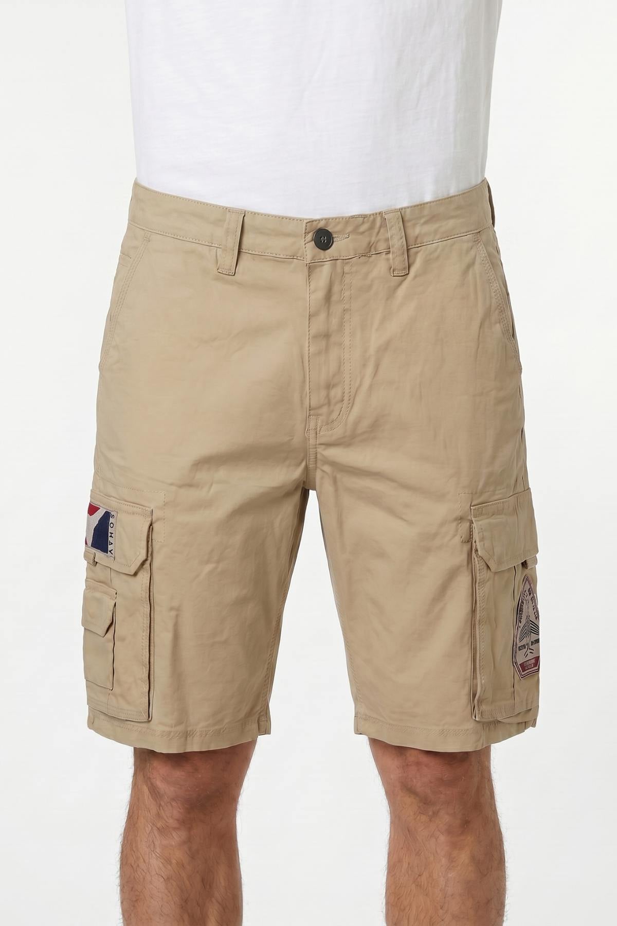 Sand-colored patched cotton Bermuda shorts - Image n°1
