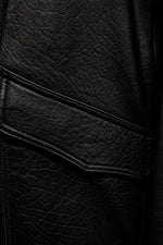 Oversized black leather jacket with detachable sleeves - Image n°5